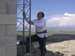 Climbing the KPIN tower at Mt. Airey, west of Pinedale.  Bob Rule photo.