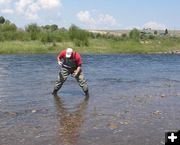 Cleaning up chemical. Photo by Wyoming Game & Fish.