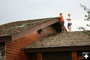 Watering down the Museum roof. Photo by Clint Gilchrist, Pinedale Online.