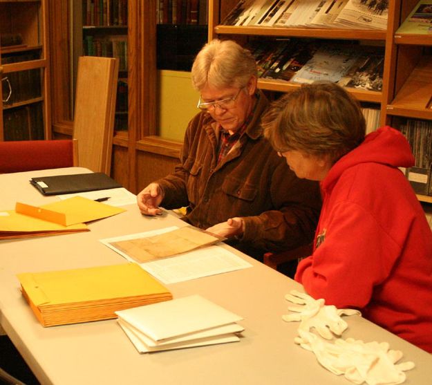 Checking documents. Photo by Dawn Ballou, Pinedale Online.