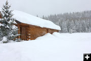 Snow up to the windows of the lodge. Photo by Kendall Valley Lodge.