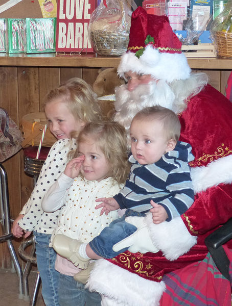 Posing with Santa. Photo by Dawn Ballou, Pinedale Online.