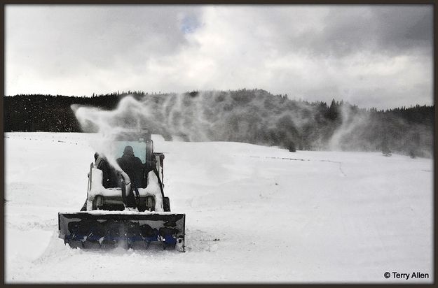Keeping the Drifts Cleared. Photo by Terry Allen.