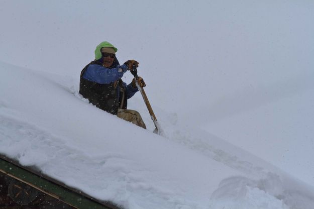 Shoveling The Roof In Bondurant. Photo by Dave Bell.