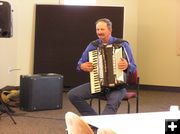 Rudy plays the accordian. Photo by Pinedale Online.