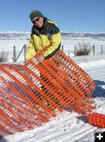 Putting fencing up. Photo by Dawn Ballou, Pinedale Online.