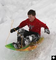 Sledding the Sidelines. Photo by Clint Gilchrist, Pinedale Online.