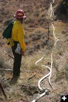 Checking the hose lay. Photo by Clint Gilchrist, Pinedale Online.