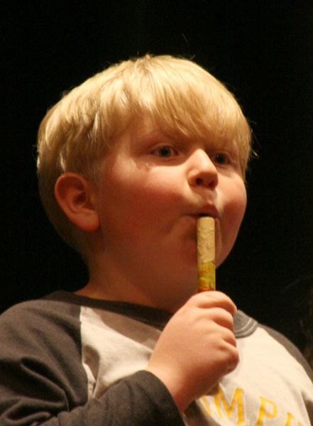 Playing the flute. Photo by Pam McCulloch, Pinedale Online.