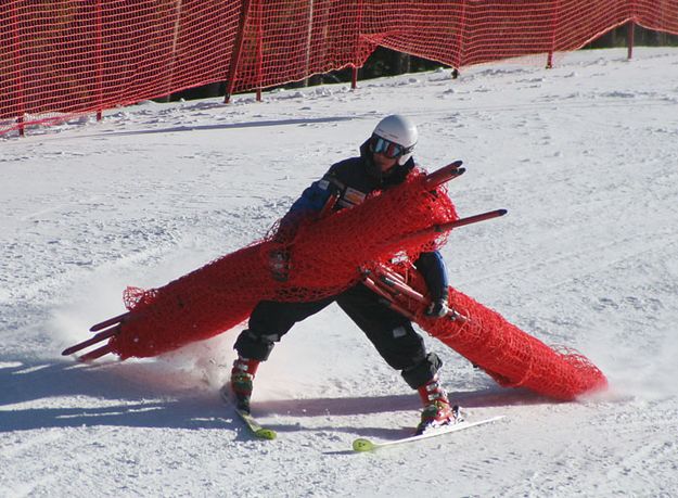 Bringing down the fencing. Photo by Pam McCulloch, Pinedale Online.