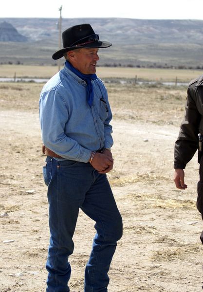 Off to jail in handcuffs. Photo by Cat Urbigkit, Pinedale Online.