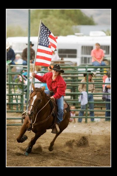 Carrying the Flag. Photo by Tara Bolgiano, Blushing Crow Photography.