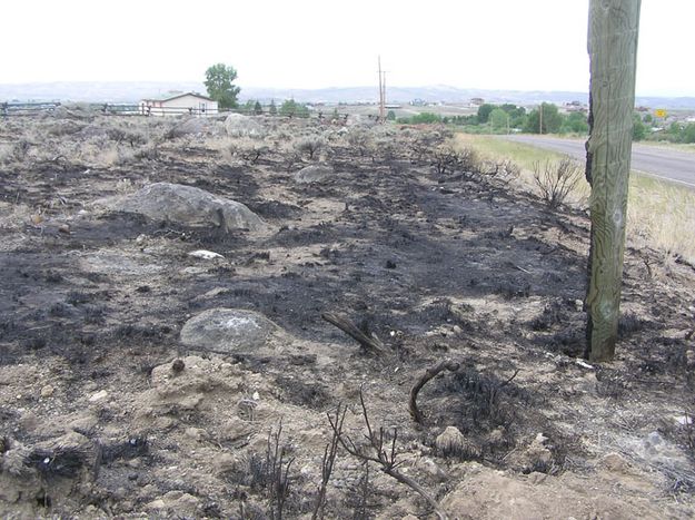 Charred fencepost. Photo by Bob Rule/KPIN 101.1 FM Pinedale Radio.