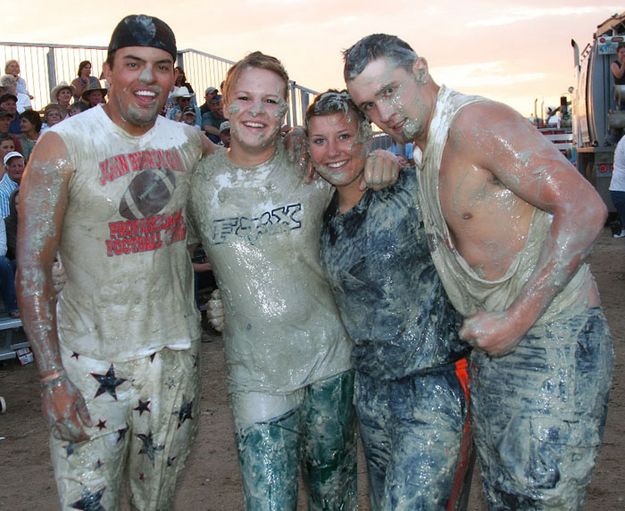 Covered in Mud. Photo by Tara Bolgiano, Blushing Crow Photography.