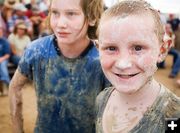 Happy Muddy Face. Photo by Tara Bolgiano, Blushing Crow Photography.