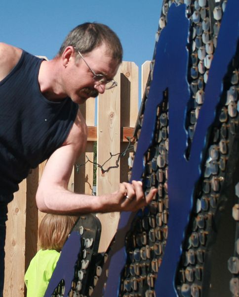 Vince working on sequins. Photo by Dawn Ballou, Pinedale Online.