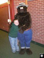 Giving Smokey a hug. Photo by Bridger-Teton National Forest.