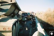 Between rail and semi. Photo by Wyoming Highway Patrol.