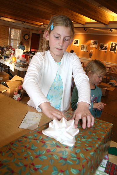 Labeling Gifts. Photo by Pam McCulloch, Pinedale Online.