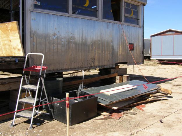 Taking off siding. Photo by Cheryl and Vince Pierce.