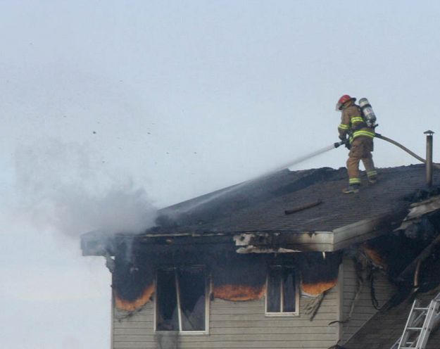 On the roof. Photo by Clint Gilchrist, Pinedale Online.