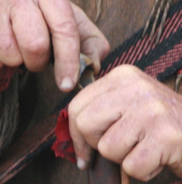 Pouring black powder into barrel. Photo by Dawn Ballou, Pinedale Online.