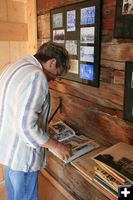 Looking at Yearbooks. Photo by Dawn Ballou, Pinedale Online.