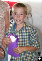 Thomas and his ribbon. Photo by Dawn Ballou, Pinedale Online.