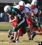 Trying to strip the ball. Photo by Clint Gilchrist, Pinedale Online.