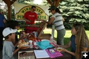 Serving Pizza. Photo by Dawn Ballou, Pinedale Online.