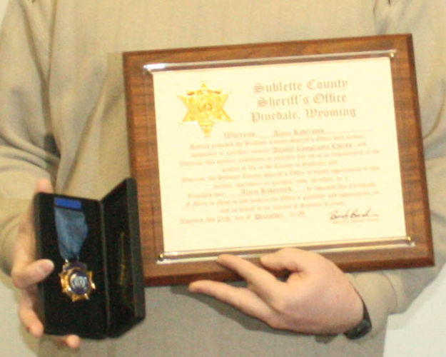 Medal and Certificate. Photo by Dawn Ballou, Pinedale Online.