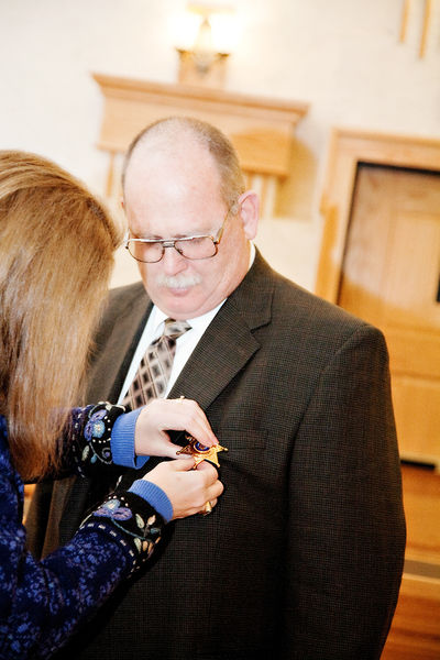 Putting on his badge. Photo by Tara Bolgiano.