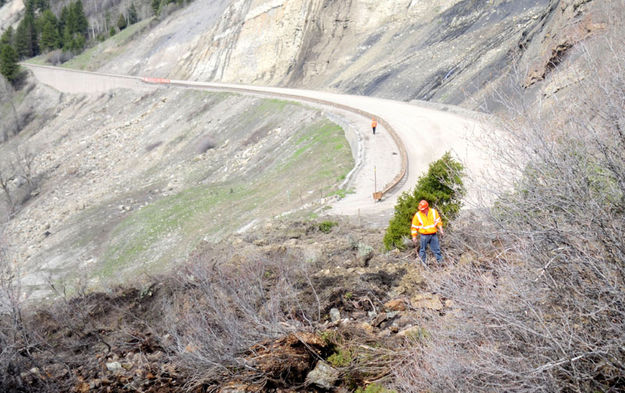 Inspecting the slide. Photo by Wyoming Department of Transportation.