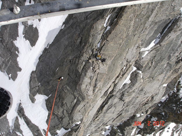 Dangling from the helicopter. Photo by Tony Chambers, Tip Top Search and Rescue.