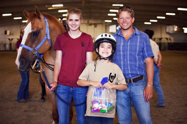 Helping kids. Photo by Tara Bolgiano, Blushing Crow Photography.