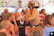 Tasting Farson honey. Photo by Dawn Ballou, Pinedale Online.