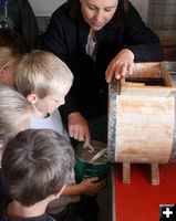 Pouring the butter. Photo by Pinedale Online.