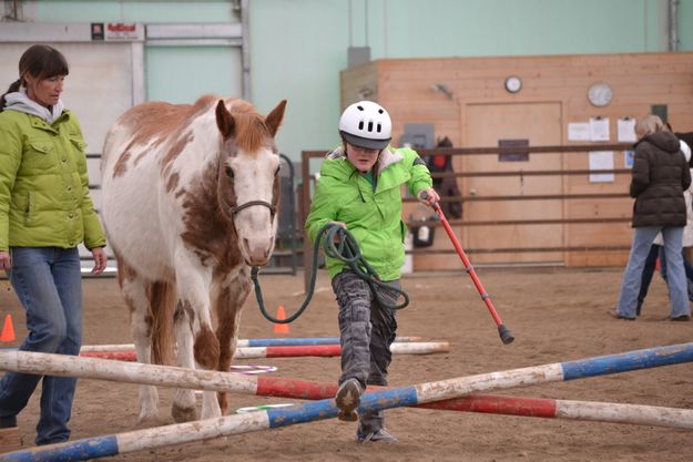 Over the crossrails. Photo by M.E.S.A. Therapeutic Horsemanship.