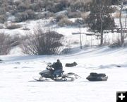 Sledding to his spot. Photo by Dawn Ballou, Pinedale Online.