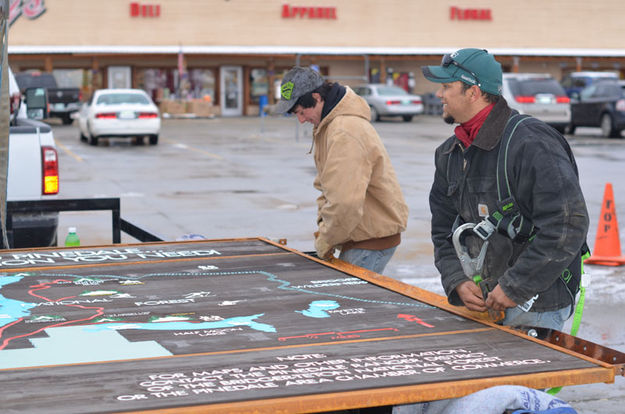 Putting on brackets. Photo by Terry Allen.