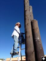 High on the ladder. Photo by Main Street Pinedale.