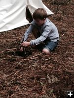 Making a fire. Photo by Sublette County Historical Society.