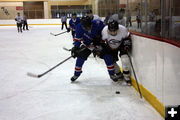 Mitchell fights for puck. Photo by Nan Stinson.