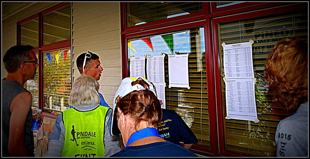 Checking Results. Photo by Terry Allen.