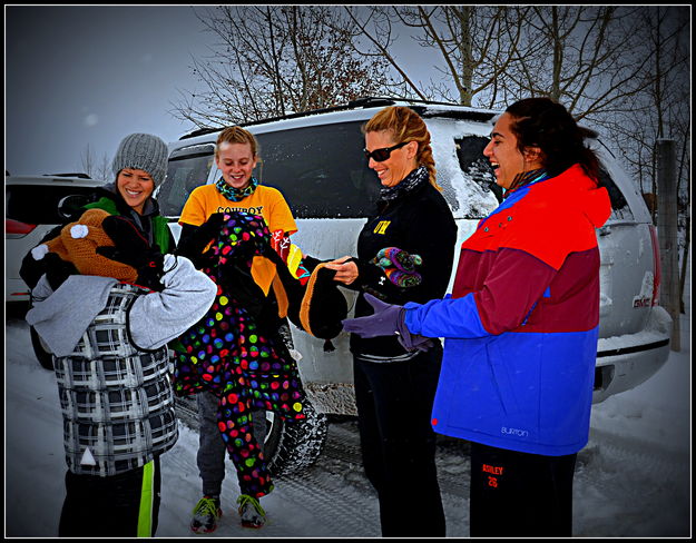 Passing out warm hats. Photo by Terry Allen.