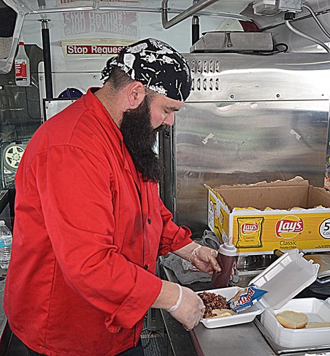 Stoney Fixes My Brisket. Photo by Terry Allen.