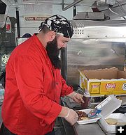 Stoney Fixes My Brisket. Photo by Terry Allen.