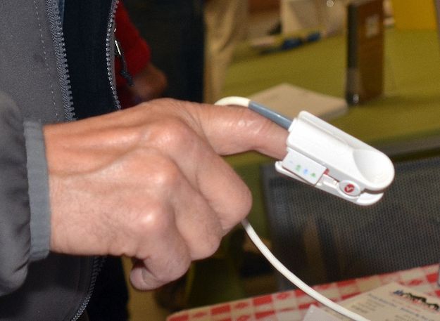 Checking Oxygen Saturation. Photo by Terry Allen.