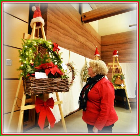 Admiring a Wreath. Photo by Terry Allen.