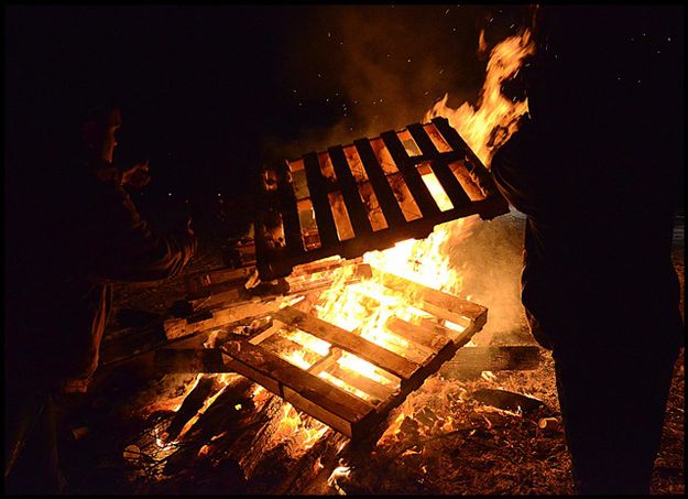 Building the Fire Higher. Photo by Terry Allen.